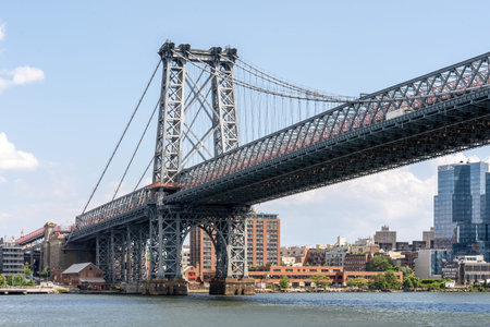 Brooklyn, NY - USA - July 30, 2021: Landscape view of the Williamsburg Bridge, a suspension bridge...