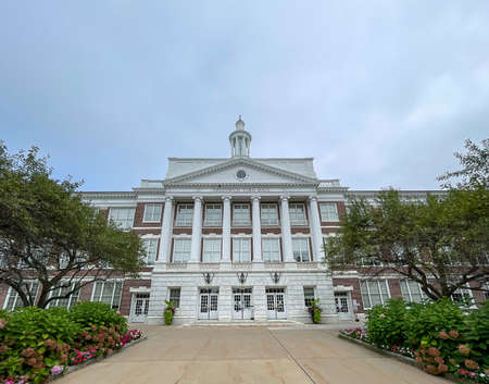 Greenwich, CT - USA - Aug. 29, 2021: Landscape image of the historic Guilbert and Betelle designed neo-classical building Greenwich CT Town Hall. Formally known as the âOldâ High School.のeditorial素材