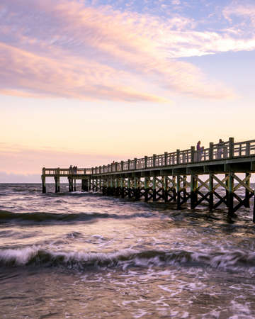 Milford, CT - USA -Oct. 16, 2021: Vertical sunset view of the Albert Munroe Pier at Walnut Beach, during the evening golden hour.のeditorial素材