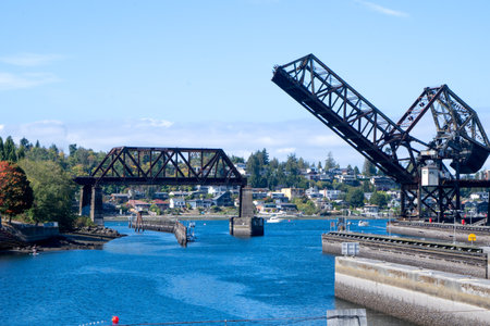 Seattle, WA - USA - Sept. 23, 2021: View of Salmon Bay Bridge, also known as Bridge No. 4, a Strauss Heel-trunnion single-leaf bascule bridge. Located west of the Hiram M. Chittenden Locks.のeditorial素材