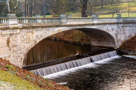 Hyde Park, NY - USA - Dec. 28, 2021: View of the elegant White Bridge, with its ornamented balustrade, is a Melan arch bridge. It spans the Crum Elbow Creek at the Vanderbilt Mansion.のeditorial素材