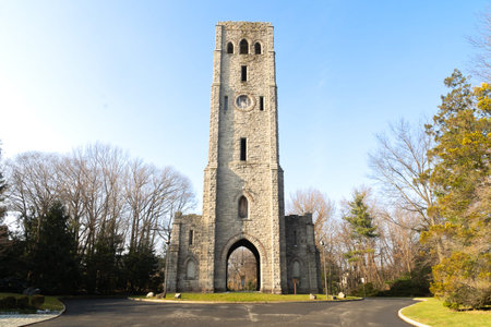 Alpine, NJ - USA - Dec. 24, 2021: View of Riondaâs Tower and Historical Marker, formerlly  known as the Alpine Stone clock tower or the Devil's Tower. Erected in 1910 by sugar baron Manuel Rionda.のeditorial素材
