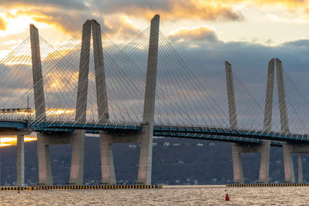 Tarrytown, NY - USA - Dec. 26, 2021: Closeup sunset view of the Governor Mario M. Cuomo Bridge, a twin cable-stayed bridge spanning the Hudson River between Tarrytown and Nyack,のeditorial素材