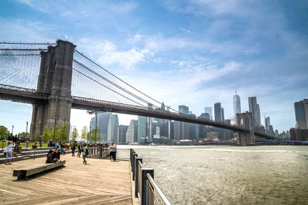 Brooklyn, NY - USA - May 20, 2022 View of the Brooklyn Bridge from  the Brooklyn side of the East River in New York City. Manhattan skyline in the distance.のeditorial素材