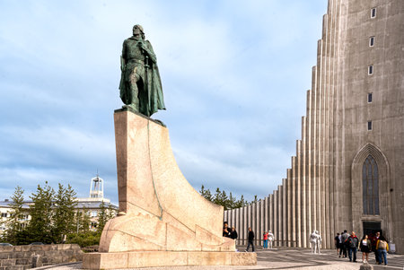 ReykjavÃ­k, Iceland - July 4, 2022 Three quarter view of the statue of the Leif Eriksson Memorial (1929â1932), This statue is at the front of the HallgrÃ­mskirkja church.のeditorial素材