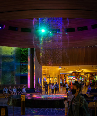 Hollywood, FL - USA - July 26, 2022 Interior view of tourists enjoying the Oculus at the Seminole Hard Rock Hotel and Casino. An advanced light show with a water fountain that synchronizes to music.のeditorial素材