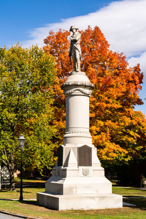 Manchester, VT - USA - Oct 9, 2022 Vertical image of the historic 1905 Soldierâs Monument in Manchester, Vermont. The base and figure were carved at Fullertonâs Marble and Granite Works.のeditorial素材