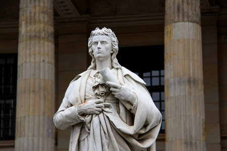 Berlin, Germany - Jun 21, 2015 Landscape closeup view of The Schiller Monument, located in central Berlin on Gendarmenmarkt, in front of the flight of steps leading up to the Konzerthaus Berlin.のeditorial素材