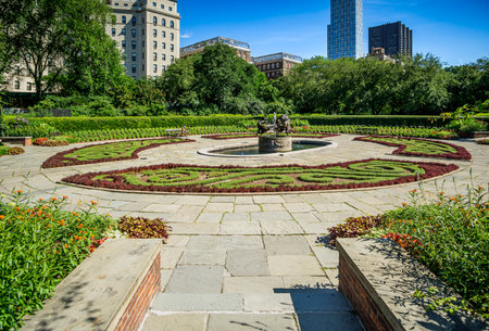New York, NY - USA - July 20, 2018 Wide angle view of Central Park Conservatory Gardenâs bronze memorial fountain, Untermyer Fountain. The Three Dancing Maidens, was designed by Walter Schott.のeditorial素材