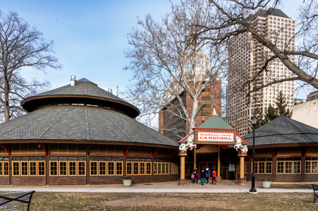 Hartford, CT - USA - Dec 28, 2022 The vintage 24-sided Bushnell Park Carousel pavilion, housing the historic 1914 Carousel, with 48 hand-carved wooden horses and two loversâ chariots in Bushnell Park.のeditorial素材