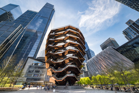 New York, NY - USA - April 14, 2023 Horizontal view of people enjoying the Vessel, a permanent art installation in the center of public plaza at the Hudson Yards complex, in Manhattan, New York City.のeditorial素材