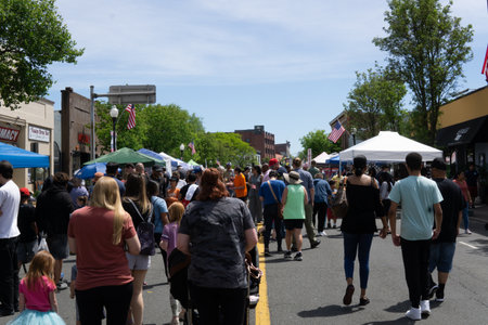 Suffern, NY - USA - May 7, 2023 view of the famous Suffern Street Fair, an annual event with diverse music, food and street vendors.のeditorial素材