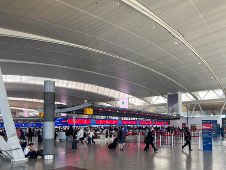 Queens, NY â USA â June 1, 2023 Wide angle view of travelers walking through the Delta Airlineâs departure hall at John F. Kennedy International Airportâs Terminal 4.のeditorial素材