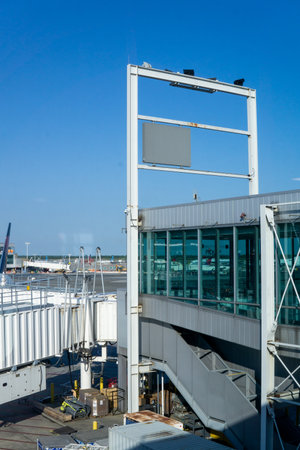 Queens, NY â USA â June 1, 2023 Landscape of a passenger boarding bridge or jetway at John F. Kennedy International Airportâs Terminal 4のeditorial素材