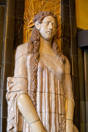 Prague, Bohemia - CZâ June 2, 2023 Vertical view of a ceramic bas-relief statue of a woman in the foyer of the iconic Art Deco Imperial Hotel in Prague.のeditorial素材
