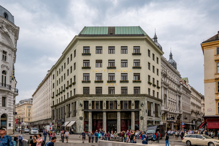 Vienna, AT - June 9, 2023 View of tourists in front of Raiffeisen Bank International an Austrian banking group at Michaelerplatz.のeditorial素材