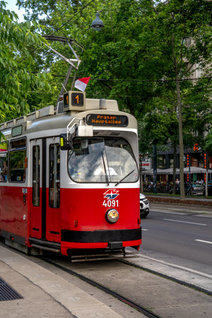 Vienna, AT â June 9, 2023 -Vertical view of the red and white  articulated tram 4091, a Vienna tram 1, operated by the Wiener Linen.のeditorial素材