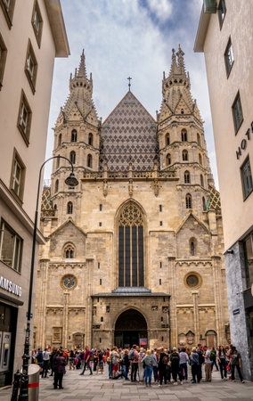 Vienna, AT - June 9, 2023 Vertical view of tourists visiting the front exterior of Romanesque and Gothic St. Stephen's Cathedral located in iStephansplatz,のeditorial素材