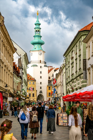 Bratislava, Slovakia â June 10, 2023 Vertical view of tourists walking to and from Michael's Gate, the entrance gate dating back to 1300's.のeditorial素材