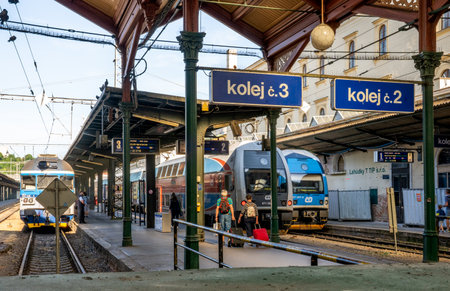 Prague, CZ - June 3, 2023 Vertical view of passengers boarding trains at the Prague Masaryk railway station, a terminal railway station in the New Town area of Prague, Czech Republic.のeditorial素材