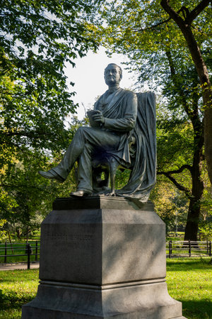 New York, NY - US - Oct 11, 2023 An outdoor bronze sculpture of Fitz-Greene Halleck by James Wilson Alexander MacDonald is installed in Central Park in Manhattan.のeditorial素材