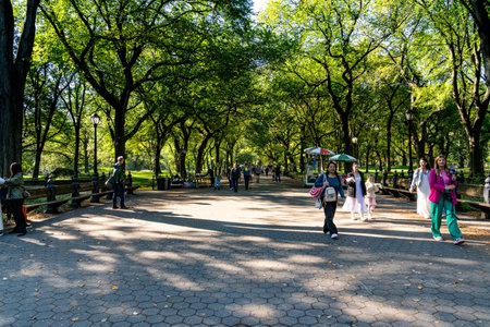New York, NY - US - Oct 11, 2023 View of visitors walking along the Mall. A walkway, lined with magnificent elms, running through the middle of New York Cityâs iconic Central Park.のeditorial素材