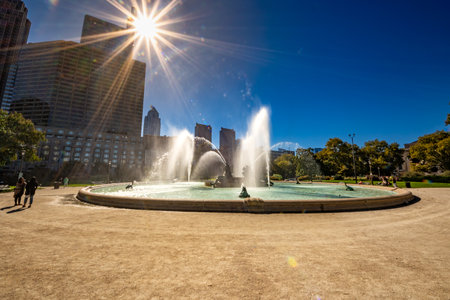 Philadelphia, PA - US - Oct 13, 2023 Wide angle view of Logan Square, a traffic circle center with a large fountain with whimsical statuary and garden areas with benches.のeditorial素材