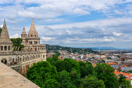 Budapest, HU â June 11, 2023 Horizontal panorama of Budapest from the Neo-Romanesque lookout terraces of the HalÃ¡szbÃ¡stya or Fisherman's Bastion, located near the Buda Castle.のeditorial素材
