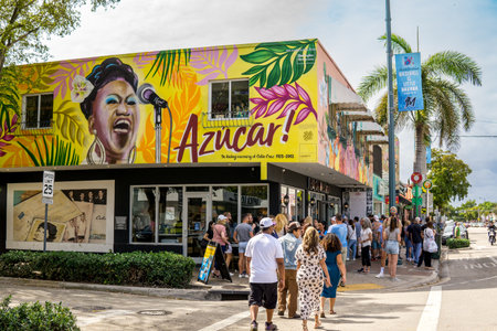 Miami, FL - US - Feb 10, 2024 Tourists walking by the shops and cafes along Calle Ocho, the iconic street in Miami's Little Havana, pulsating with vibrant energy and cultural richness.のeditorial素材