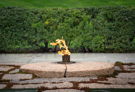 Arlington VA - US - Mar 23, 2024 Landscape view the John F. Kennedy Eternal Flame, a presidential...