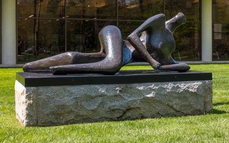 Purchase, NY â US â Apr 28, 2024 Henry Mooreâs Reclining Figure, a bronze sinuous abstracted human figure on the Donald M Kendall Sculpture Gardens at the PepsiCo World headquarters in Purchaseのeditorial素材