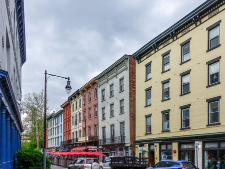 Kingston, NY - US - May 11, 2024 A view down quaint West Strand Street, lined with charming shops and inviting restaurants. Located in the heart of Kingston's Historic Rondout District.のeditorial素材
