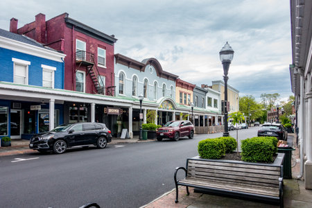 Kingston, NY - US - May 11, 2024 View down historic Wall Street, lined with restaurants, storefronts, office buildings, and apartment buildings in the quaint Stockade District of Kingston.のeditorial素材