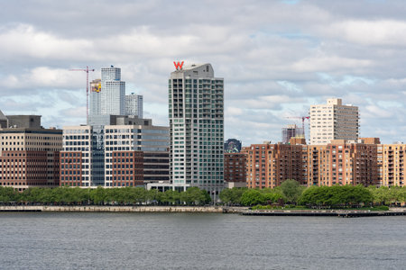 New York, NY - US - May 19, 2024 View of the iconic Hoboken skyline; highlighting the W Hotel and the Hudson River Waterfront Walkway. Seen across the Hudson River.のeditorial素材
