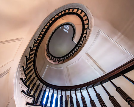 Bronx, NY - US - July 13, 2024 The BartowâPell Mansionâs iconic elliptical stairway is a stunning focal point, featuring elegant curves, ornate railings, and a grand design that epitomizes historic luxury.のeditorial素材