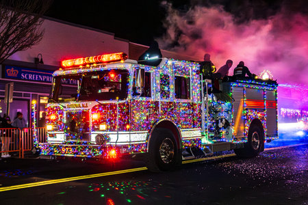 Suffern, NY - US - Dec 6, 2025 A Totowa, NJ fire engine covered in vibrant Christmas lights drives...