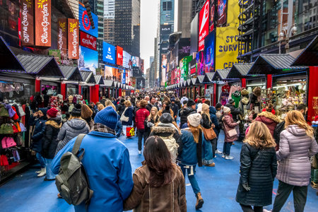 New York, NY - US - Dec 13, 2025 Vibrant holiday market bustling with crowds on Broadway in NYC,...
