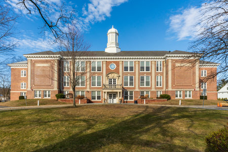 Greenwich, CT - US - Jan 11, 2026 Traditional Colonial-style red brick Cos Cob School in Greenwich, Connecticut, featuring a white cupola against a bright blue sky on a winter day.のeditorial素材