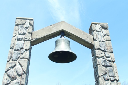 a distant view of a church bell, showing more of the supporting structureの写真素材