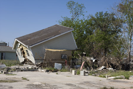 Heavily damaged homes in the Ninth Ward of New Orleans. One block behind these homes is the...
