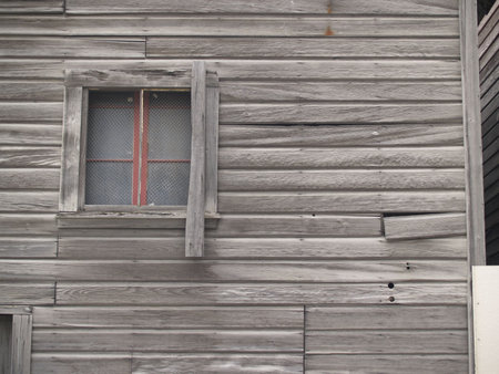 Close up section of old building wall, and windo.