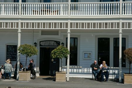 Martinborough, New Zealand, Patrons enjoy the outdoors dining at the wine towns Martinborough Hotel.のeditorial素材