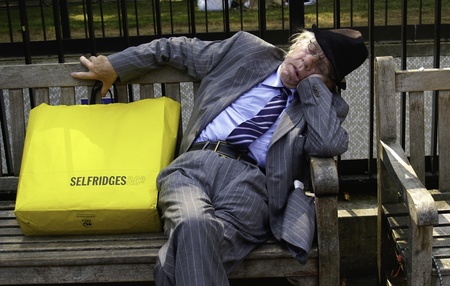 London, England, July 3 2009, Elderly man falls asleep after shopping.のeditorial素材