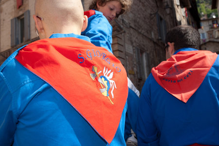 Gubbio, Italy, May 15 2011, The red scarf of Saint Giorgio on man taking part in the Festa Dei Ceri.のeditorial素材