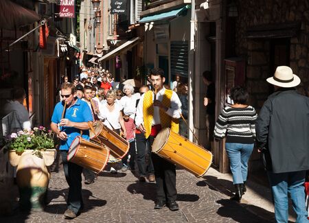 Antibes, France, May 1, 2011 Marchers beating drums lead crowd in May Day parade..のeditorial素材
