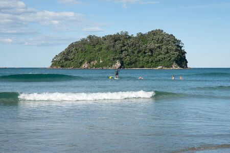 Tauranga, New Zealand, January 23, 2012, Paddleboarders enjoy scenic beach at Mount Maunganui. のeditorial素材
