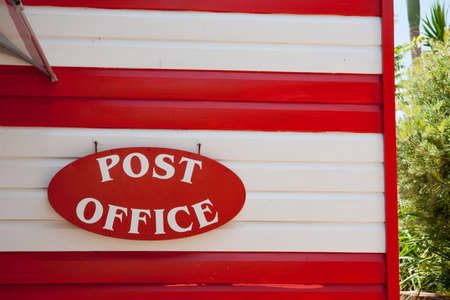 Post Office sign in red and white の写真素材