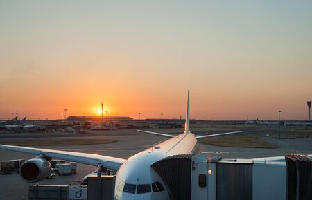 London, England - August 2, 2013; Heathrow airport with plane parked and runway beyond のeditorial素材