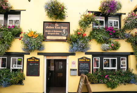 Padstow, England - July 31, 2013; The Golden Lion Hotel is a colorful establishment in the historic fishing village のeditorial素材