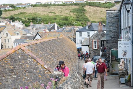 Port Isaac, England; July 31,2013  tourists wander and photograph the narrow lanes of Port Isaac のeditorial素材